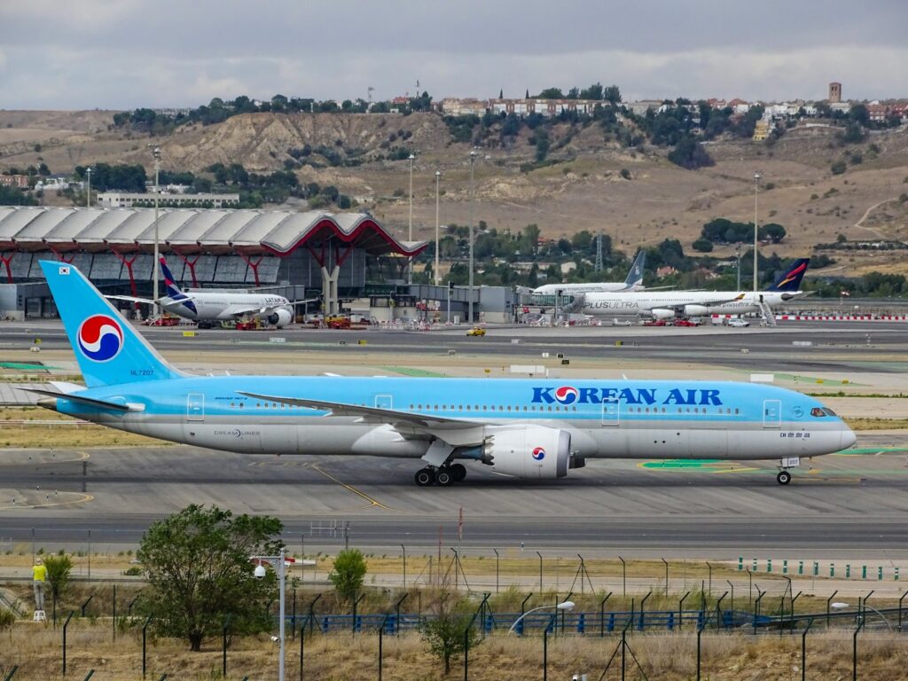 blue Korean Air airplane on runway
